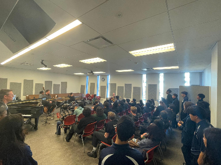 Picture of clinicians working with students at the tune-up festival