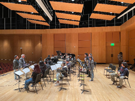 Picture of clinicians working with students at the tune-up festival
